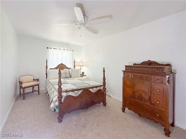 2910 2nd St NE, Naples, FL 34120 - bedroom with light colored carpet, baseboards, and ceiling fan