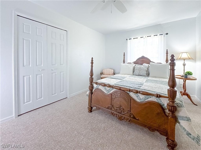 carpeted bedroom with a closet and ceiling fan