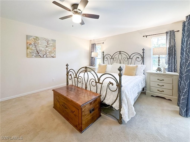2910 2nd St NE, Naples, FL 34120 - bedroom featuring light carpet, ceiling fan, and baseboards