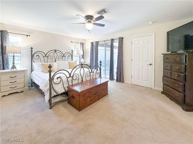 bedroom featuring ceiling fan, light carpet, and access to outside