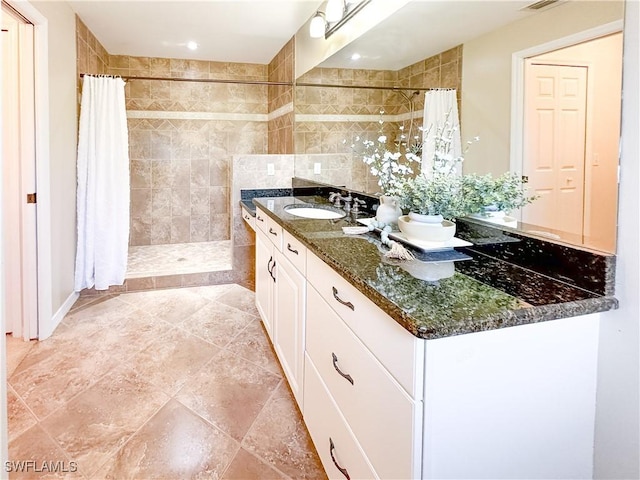 2910 2nd St NE, Naples, FL 34120 - full bathroom with vanity, a tile shower, recessed lighting, and tile patterned floors