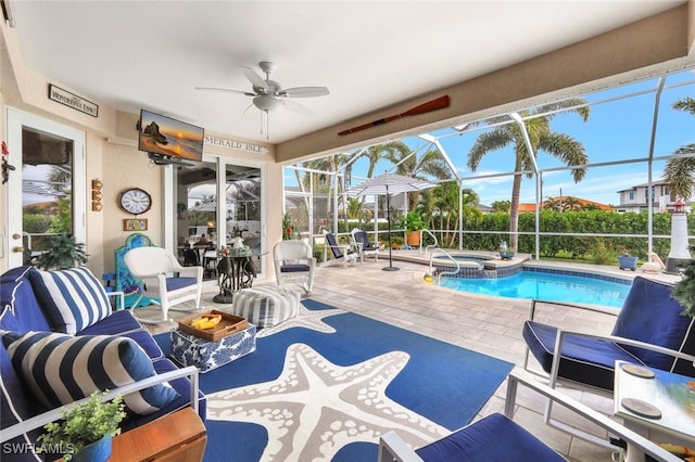 view of swimming pool featuring a patio, glass enclosure, an in ground hot tub, and ceiling fan