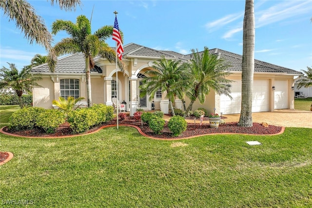 view of front of property featuring a garage and a front lawn