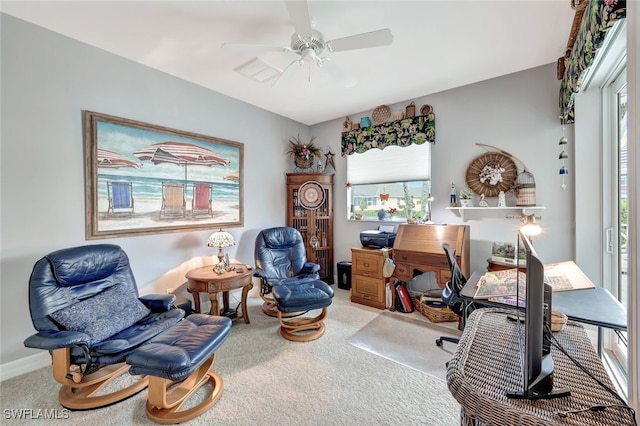 home office with a ceiling fan, carpet flooring, and plenty of natural light