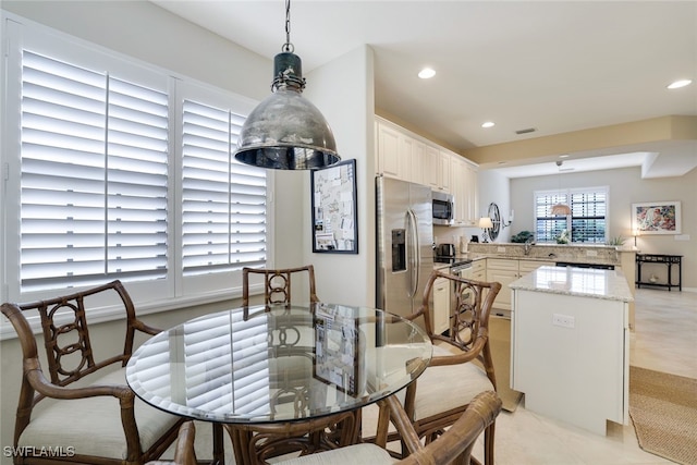 dining area with light tile patterned floors