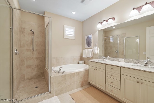 bathroom with vanity, separate shower and tub, and tile patterned floors