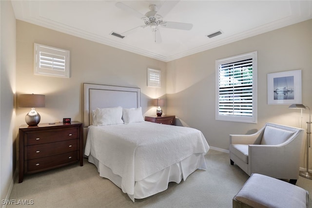 carpeted bedroom featuring crown molding and ceiling fan