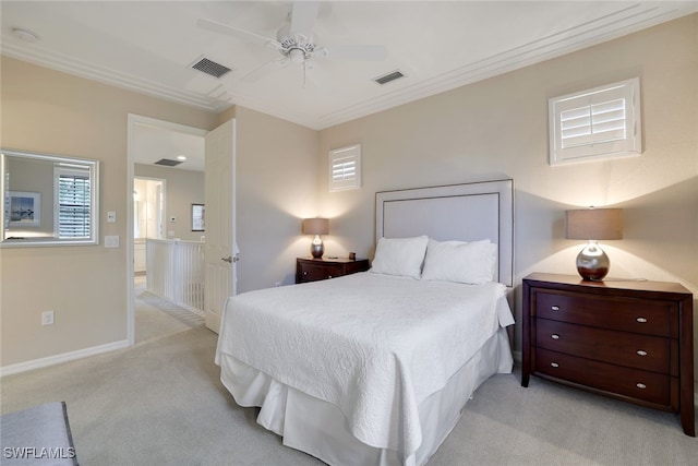 bedroom with light carpet, crown molding, and ceiling fan