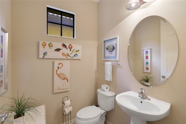 bathroom featuring sink and toilet