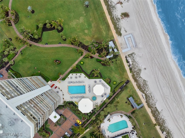 bird's eye view with a water view and a view of the beach