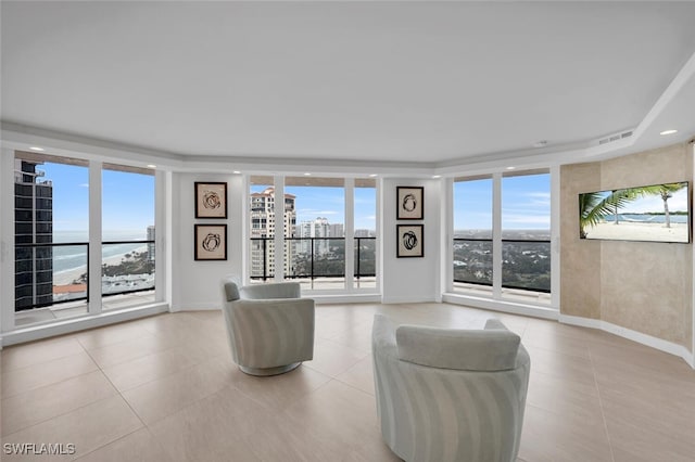 tiled living room featuring expansive windows