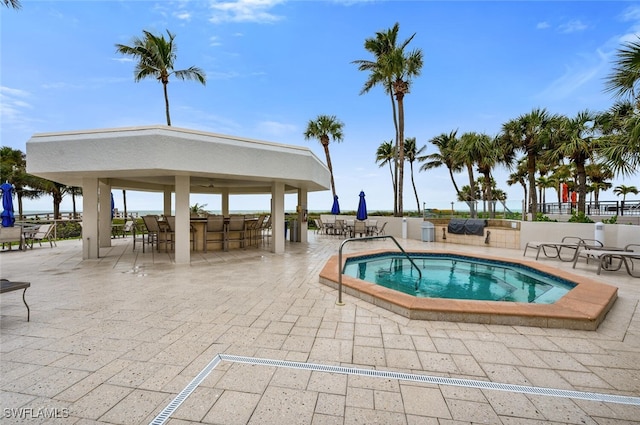 view of pool with a gazebo, a hot tub, and a patio