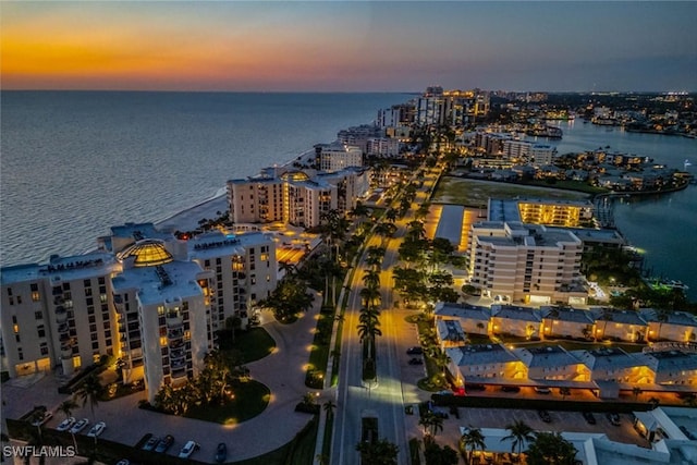 aerial view at dusk with a water view