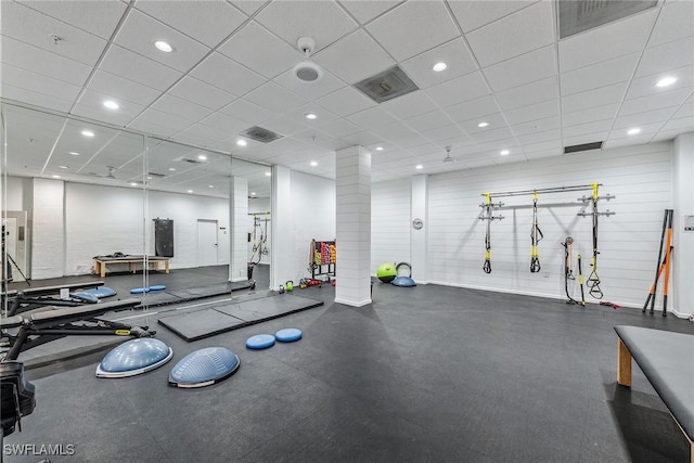 gym featuring a paneled ceiling