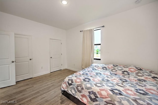 bedroom with light hardwood / wood-style flooring