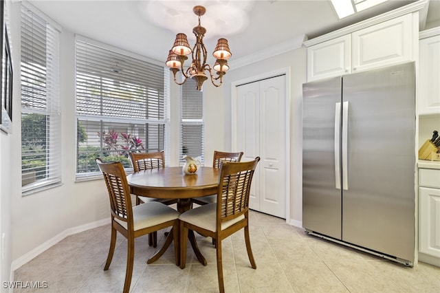 dining area with crown molding, light tile patterned floors, and a notable chandelier