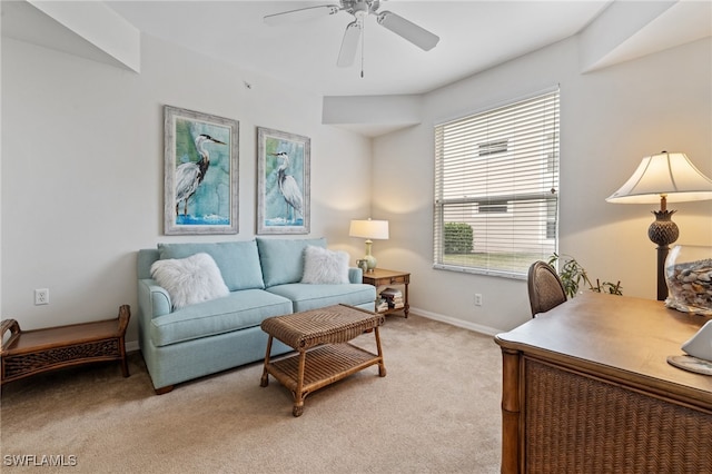 living room featuring light carpet and ceiling fan