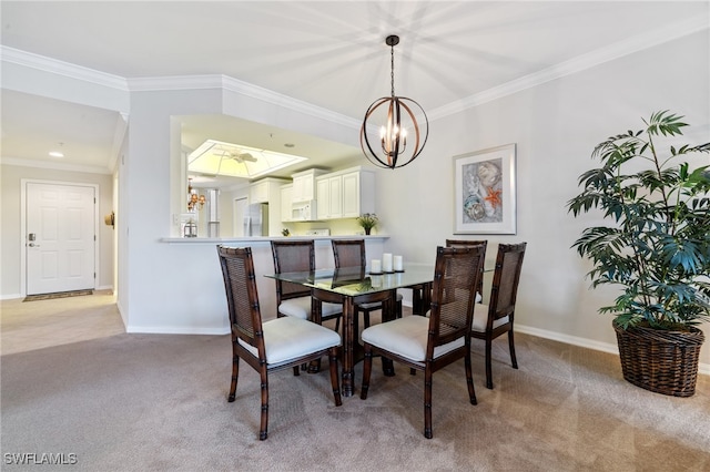 dining space with an inviting chandelier, ornamental molding, and light colored carpet