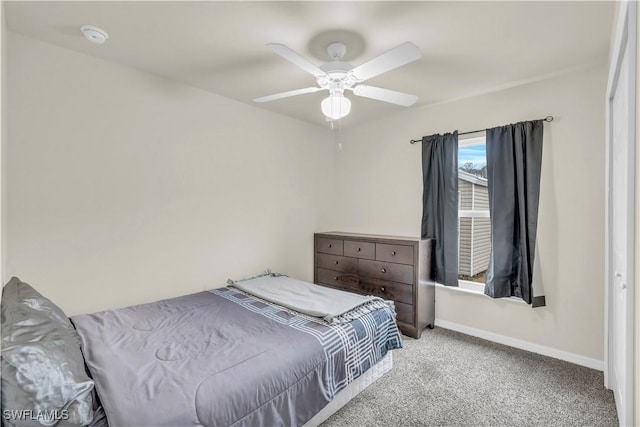 carpeted bedroom with ceiling fan