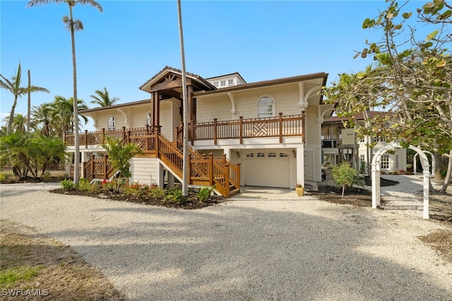 view of front of property featuring a garage and covered porch