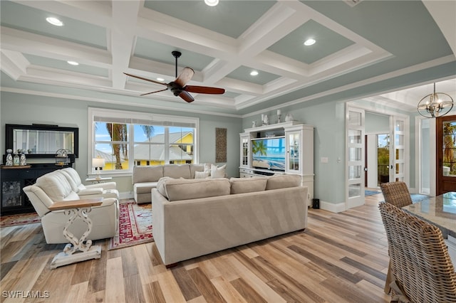 living room featuring crown molding, coffered ceiling, beam ceiling, and light hardwood / wood-style flooring