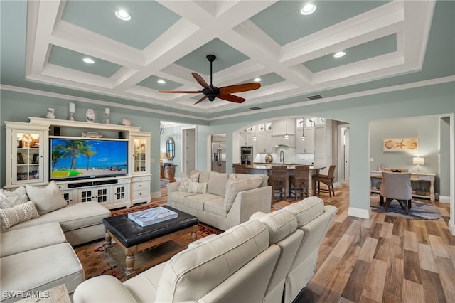 living room with crown molding, coffered ceiling, and beam ceiling