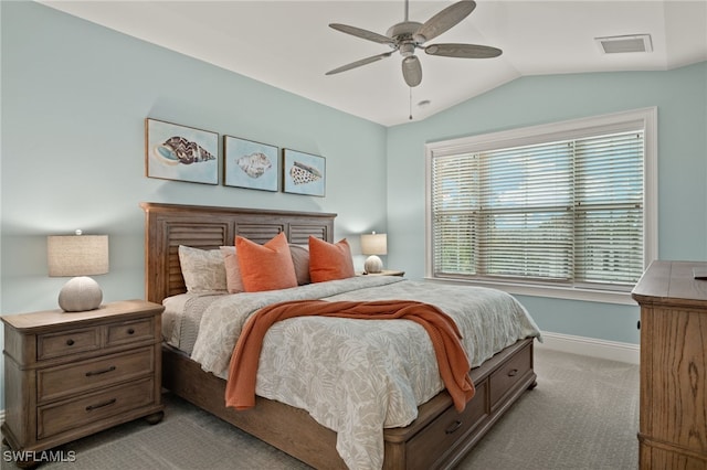 carpeted bedroom featuring lofted ceiling and ceiling fan