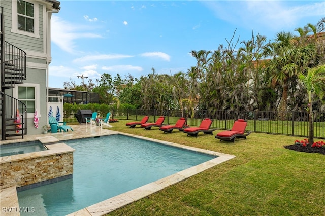 view of swimming pool with an in ground hot tub, a lanai, a patio area, and a lawn