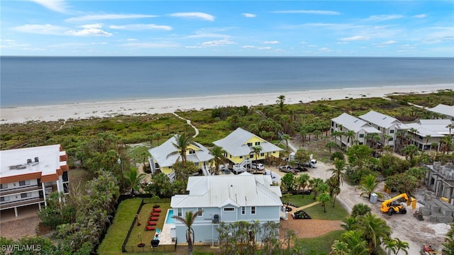 bird's eye view featuring a view of the beach and a water view