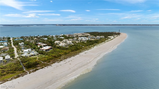 birds eye view of property with a view of the beach and a water view