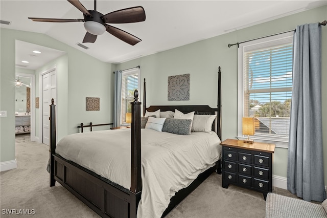 carpeted bedroom featuring vaulted ceiling and ceiling fan