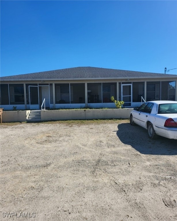 view of front facade featuring a sunroom