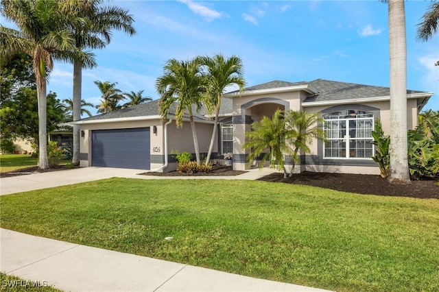 view of front facade with a garage and a front lawn