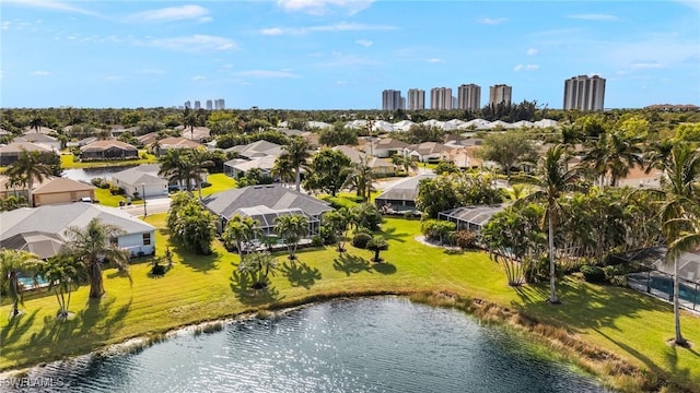 birds eye view of property with a water view