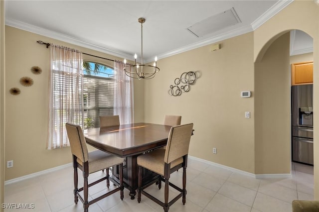 dining space featuring crown molding and light tile patterned floors