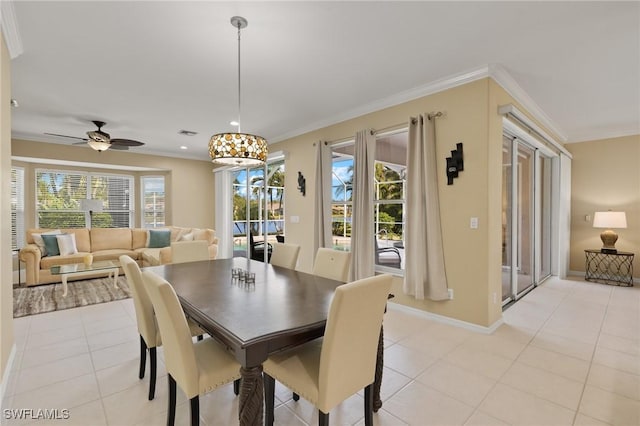 tiled dining room with ornamental molding and ceiling fan