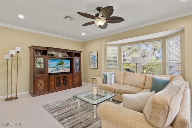 living room featuring light tile patterned floors, ornamental molding, and ceiling fan