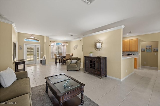 tiled living room featuring crown molding and french doors