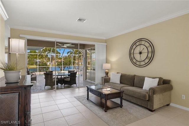 tiled living room with crown molding and ceiling fan