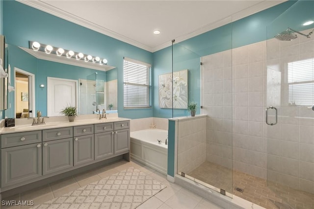 bathroom featuring crown molding, tile patterned floors, shower with separate bathtub, and vanity