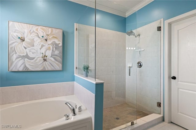 bathroom with tile patterned floors, ornamental molding, and separate shower and tub