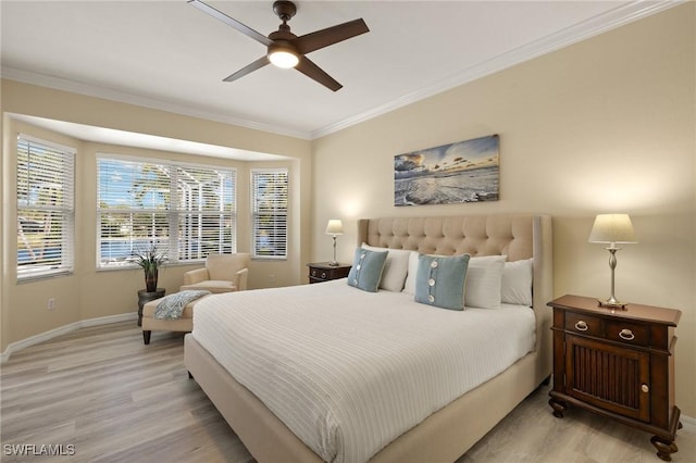 bedroom with crown molding, ceiling fan, and light hardwood / wood-style floors