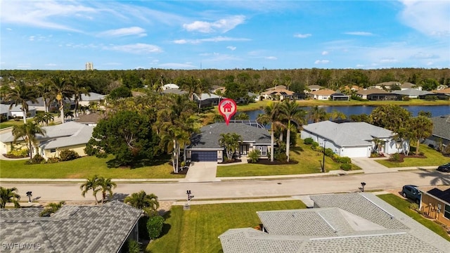 birds eye view of property featuring a water view