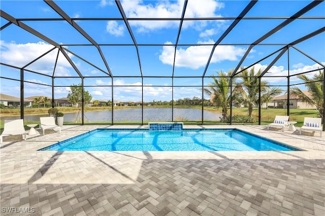 view of pool with a patio area, a water view, and glass enclosure