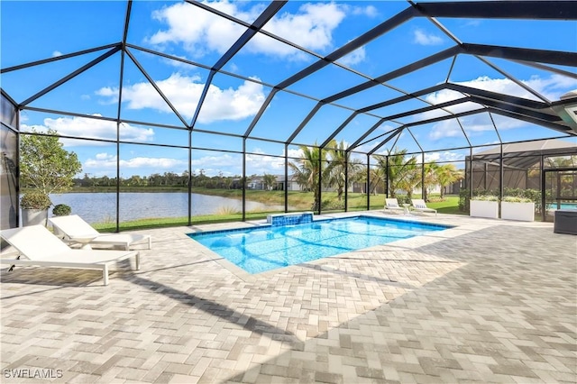 view of pool featuring a water view, a lanai, and a patio area