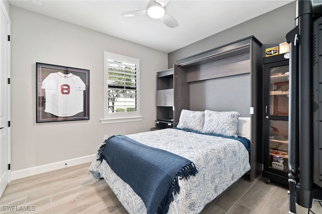 bedroom featuring wood-type flooring and ceiling fan