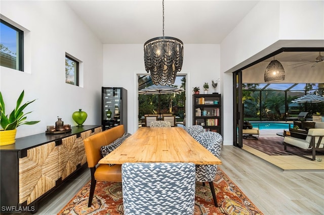 dining room featuring hardwood / wood-style floors and an inviting chandelier