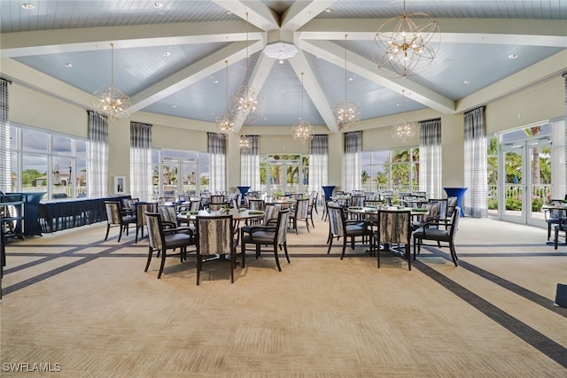 carpeted dining room with an inviting chandelier, beam ceiling, and a high ceiling