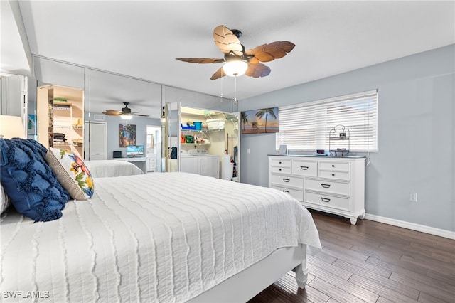 bedroom featuring dark wood-type flooring, washer and dryer, and ceiling fan