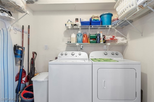 laundry area with washing machine and clothes dryer